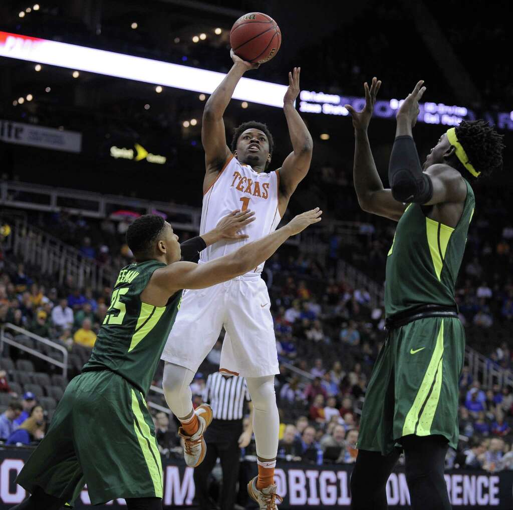 KANSAS CITY, MO - MARCH 10: Isaiah Taylor #1 of the Texas Longhorns shoots against Al Freeman #25 and Johnathan Motley #5 of the Baylor Bears in the first half during the quarterfinals of the Big 12 Basketball Tournament at Sprint Center on March										
					<p><a href=