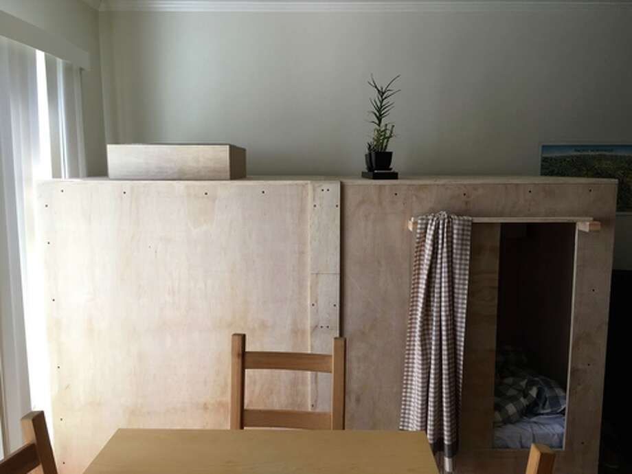Illustrator Peter Berkowitz is avoiding San Francisco's high rent by paying only $400 to live in a box in a friend's living room. Photo: Peter Berkowitz