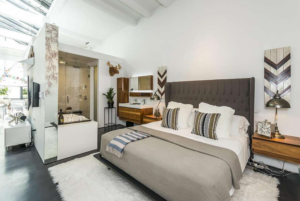 This bedroom off the great room includes an en-suite bath. Photo: Olga Soboleva / Vanguard Properties