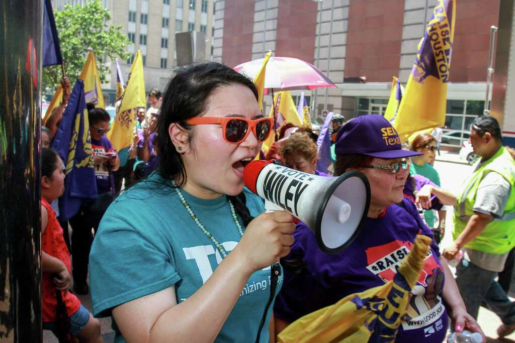 Constance C. Luo, an immigration organizer with Texas Organizing Project, protest with janitors and members of Service Employees International Union Texas (SEIUTX) protest unfair treatment to janitors and commemorate "Justice for Janitors Day" during protest in downtown Houston. (For the Chronicle/Gary Fountain, June 15, 2016) Photo: Gary Fountain, For The Chronicle / Copyright 2016 Gary Fountain