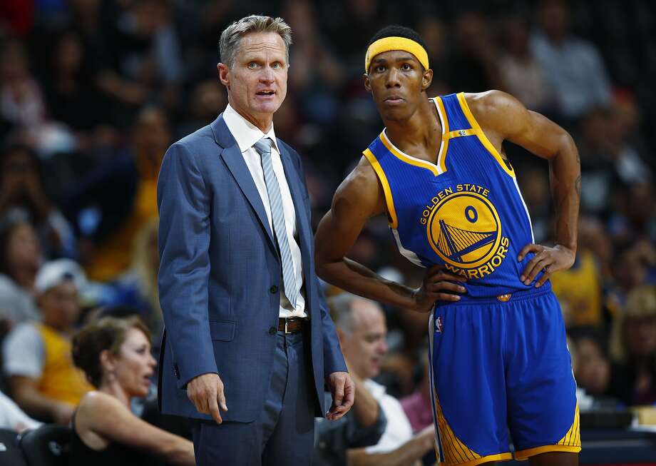 Golden State Warriors coach Steve Kerr, left, confers with guard Patrick McCaw in overtime of an NBA preseason basketball game against the Denver Nuggets on Friday, Oct. 14, 2016, in Denver. The Warriors won 129-128 in overtime. (AP Photo/David Zalubowski) Photo: David Zalubowski, Associated Press