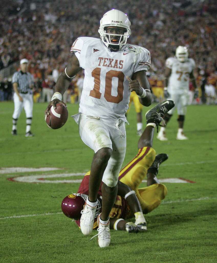 Texas quarterback Vince Young rushes for the game-winning touchdown against Southern California as Texas meets Southern California in the Rose Bowl, the national championship college football game in Pasadena, Calif., Wednesday, Jan. 4, 2006. Texas won the game 41-38.  (AP Photo/Paul Sakuma) Photo: PAUL SAKUMA, STF / 2006 AP