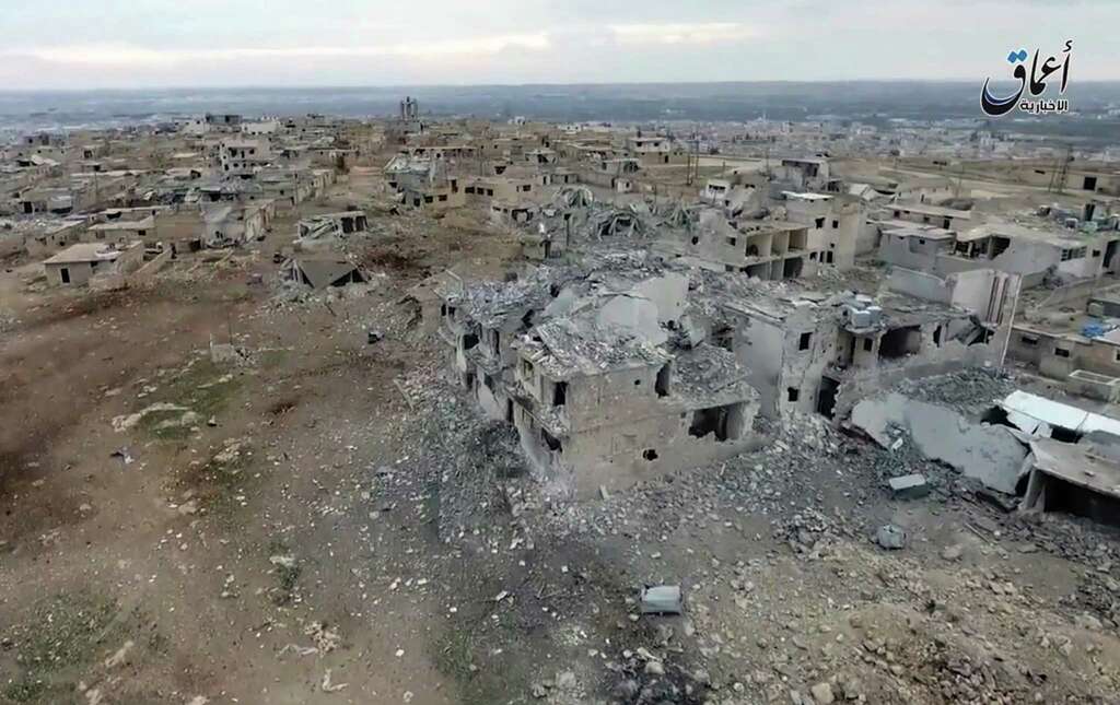 This still image taken from drone footage posted online Monday, Jan. 2, 2017 by the Aamaq News Agency, a media arm of the Islamic State group, purports to shows an aerial image of a neighborhood damaged by Turkish airstrikes in the northern Syrian town of al-Bab, in Aleppo province, Syria. Nearly two months into the assault, Turkey has become bogged down in an unexpectedly bloody fight to retake the Islamic State groupÂs last stronghold in northern Syria. It has been forced to pour in troops, take the lead in the battle from its Syrian allies and reach out to Russia for aerial support -- a move that tests its alliance with the United States and the Syrian opposition. (Aamaq News Agency via AP) Photo: Uncredited, UGC / Amaq News Agency