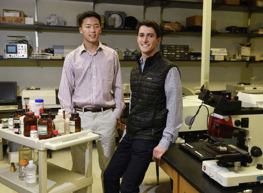 GHS seniors Derek Woo, left, and Ethan Novek pose in the science lab at Greenwich High School in Greenwich, Conn. Wednesday, Jan. 24, 2017. Woo and Novek are finalists in the 2017 Regeneron Science Talent Search, the prestigious pre-college science competition. Photo: Tyler Sizemore / Hearst Connecticut Media / Greenwich Time