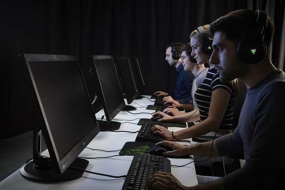 A group of male and female gamers playing PC games while wearing headsets, taken on November 6, 2015. (Photo by Olly Curtis/Future Publishing via Getty Images)