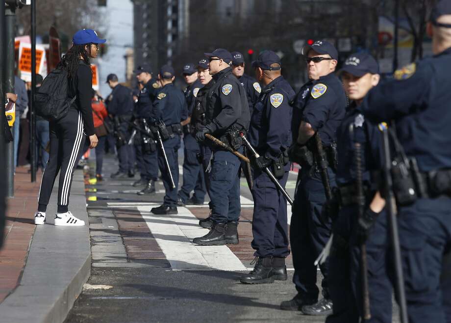 A line of San Francisco police officers separates demonstrators on both sides of the abortion debate, an issue that divides urban and rural voters. Photo: Paul Chinn, The Chronicle