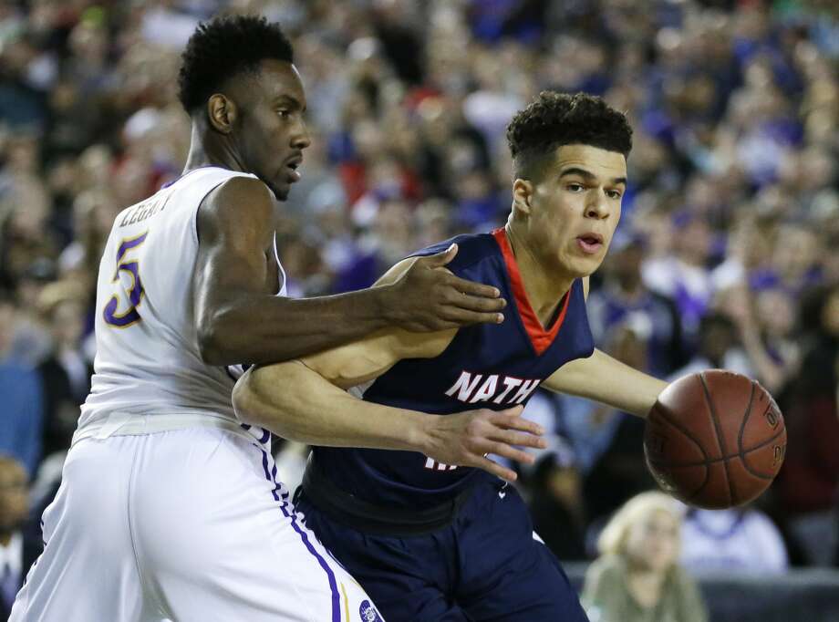 Nathan Hale forward Michael Porter Jr., right, drives around Garfield guard Jaylen Nowell during the first half of the Washington state boys' 3A high school basketball championship, Saturday, March 4, 2017, in Tacoma, Wash. (AP Photo/Ted S. Warren) Photo: Ted S. Warren/AP
