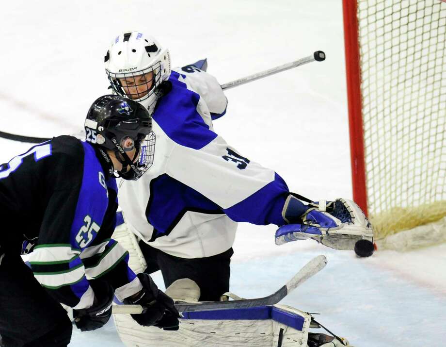 Tri-Falls' Jared Thomas (25) scores against Saratoga golatender Tom Fornabia (31) in the third  period of a section II high school hockey championship game Thursday, Feb. 25, 2016, in Schenectady, N.Y., Saratoga won the game 8-1.(Hans Pennink / Special to the Times Union) ORG XMIT: HP114 Photo: Hans Pennink / Hans Pennink