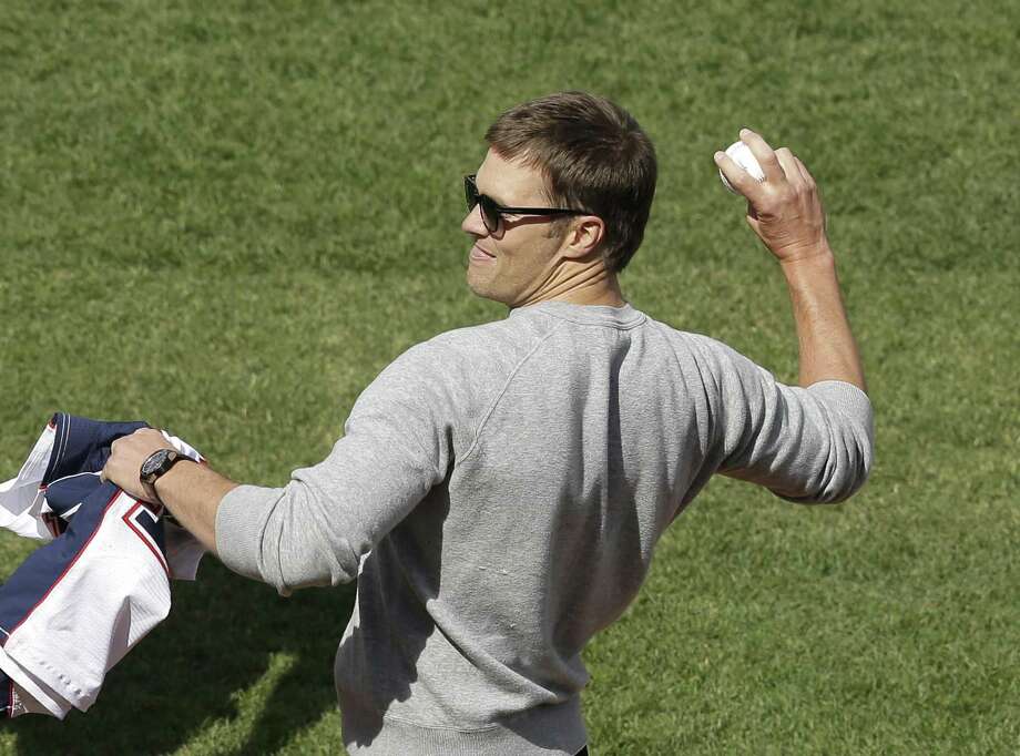 New England Patriots quarterback Tom Brady throws a ceremonial first pitch before a baseball game between the Boston Red Sox and the Pittsburgh Pirates on opening day at Fenway Park, Monday, April 3, 2017, in Boston. (AP Photo/Steven Senne) Photo: Steven Senne, STF / Associated Press / AP