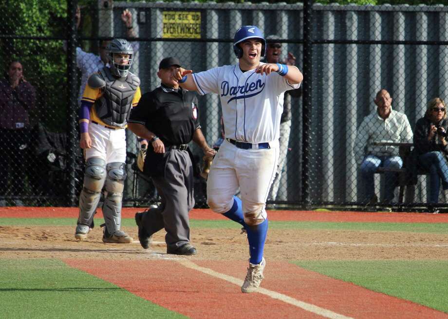 Darien's Sean O'Malley celebrates as his sixth-inning three-run homerun clears the fence during an FCIAC baseball game between Darien and Westhill on May 11, 2017  at Darien High School in Darien, Conn. Westhill defeated Darien 10-8. Photo: Anthony E. Parelli / Hearst Connecticut Media / Darien News