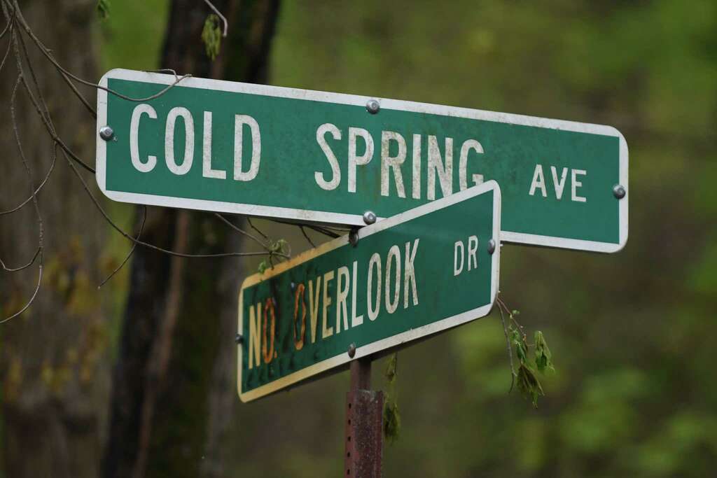 Road sign at Cold Spring Avenue and No Overlook Drive near the scene of a fire on Monday, May 15, 2017, in Schodack, N.Y. Authorities said someone set fire to a building at 29 Cold Spring on Sunday and the fire is considered a hate crime. Schodack police do not identify the race or religion of the homeowners but a source says the victims are black. (Will Waldron/Times Union) Photo: Will Waldron / 20040517A