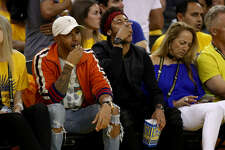 Formula One driver Lewis Hamilton and FC Barcelona football player Neymar Jr attend Game 2 of the 2017 NBA Finals at ORACLE Arena on June 4, 2017 in Oakland, California.&nbsp;