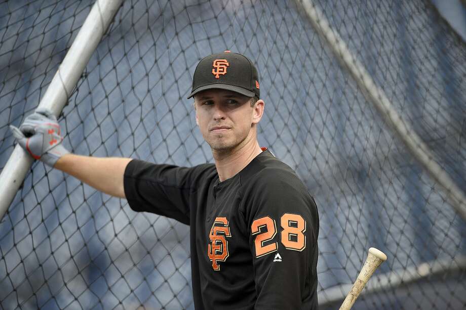 San Francisco Giants' Buster Posey looks on during batting practice before a baseball game against the Washington Nationals, Saturday, Aug. 12, 2017, in Washington. (AP Photo/Nick Wass) Photo: Nick Wass, Associated Press
