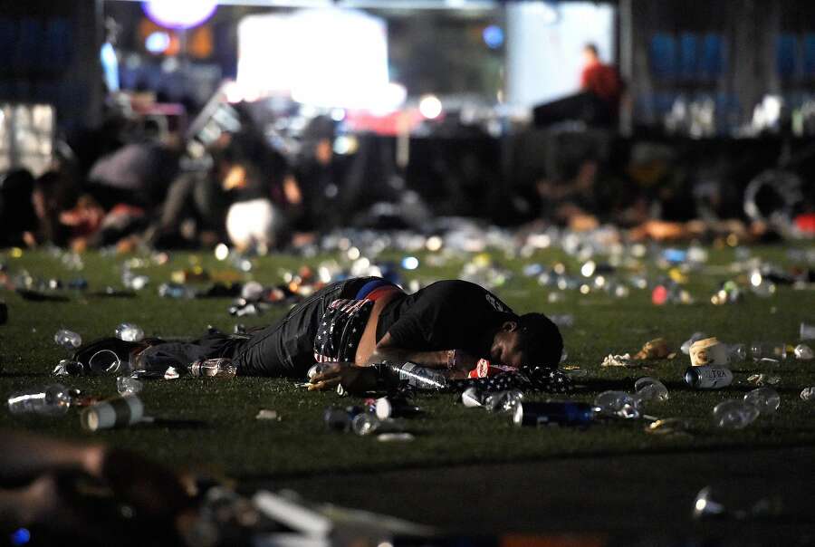 A person lies on the ground at the Route 91 Harvest country music festival after gun fire was heard on October 1st, 2017, in Las Vegas, Nevada.  Photograph: David Becker/Getty Images.