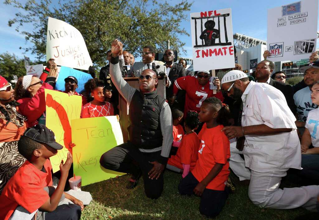 Protesters kneel to show their support to former San Francisco 49ers quarterback Colin Kaepernick on social issues and condemn Houston Texans owner Bob McNair for his "inmates" remark at NRG Parkway and Kirby Drive outside of NRG Stadium on Sunday, Nov. 19, 2017, in Houston. ( Yi-Chin Lee / Houston Chronicle ) Photo: Yi-Chin Lee, Houston Chronicle / © 2017  Houston Chronicle