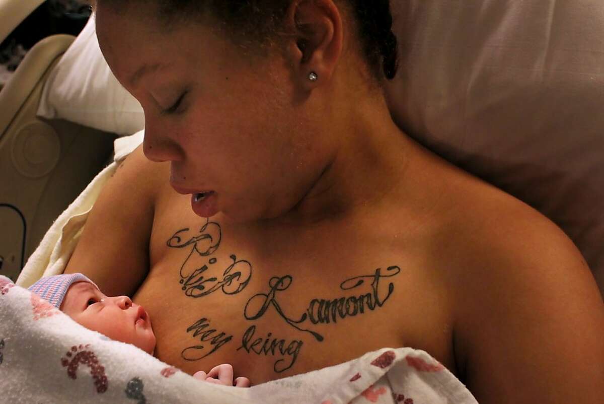 Brijjanna Price, 16, holds her newborn baby La'Mya Deshana Price for the first time, Thursday Nov. 8, 2012, at Alta Bates Summit Medical Center in Berkeley, Calif. Her daughter was named after Brijjanna's brother Lamont, who was killed in February of 2012. Photo: Lacy Atkins, The Chronicle