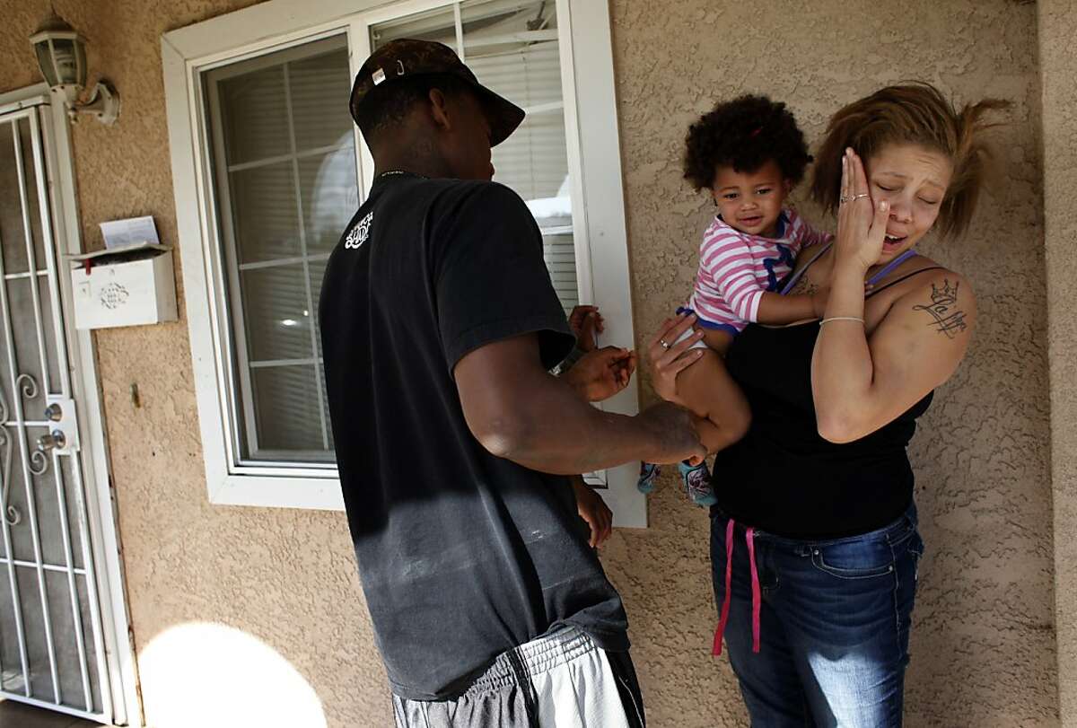 Brijjanna Price covers her face as her boyfriend Quindell Anderson yells at her about their daughter's dirty diaper on Wednesday, November 6, 2013, in Hayward, Calif. Photo: Lacy Atkins, The Chronicle