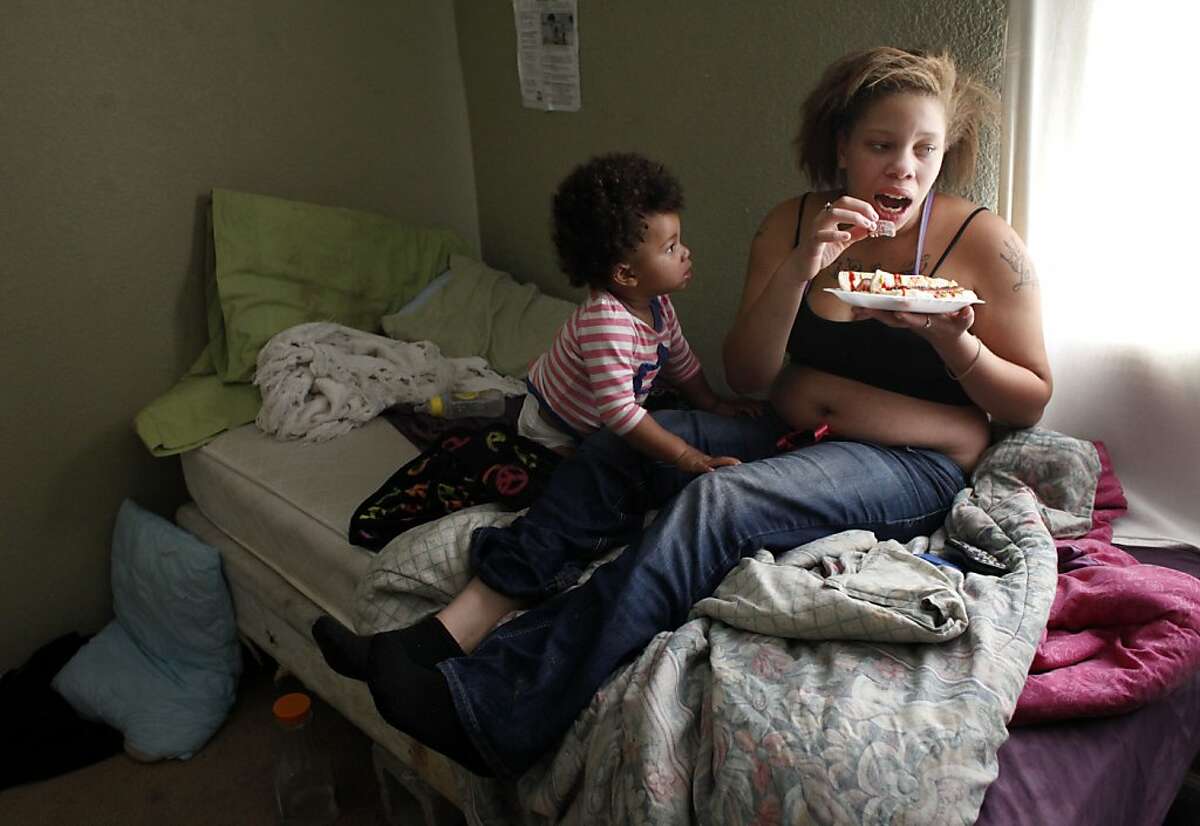 LaMya Price tries to get her mother to give her a bite of her hotdog on Wednesday, November 6, 2013, in Hayward, Calif. Photo: Lacy Atkins, The Chronicle