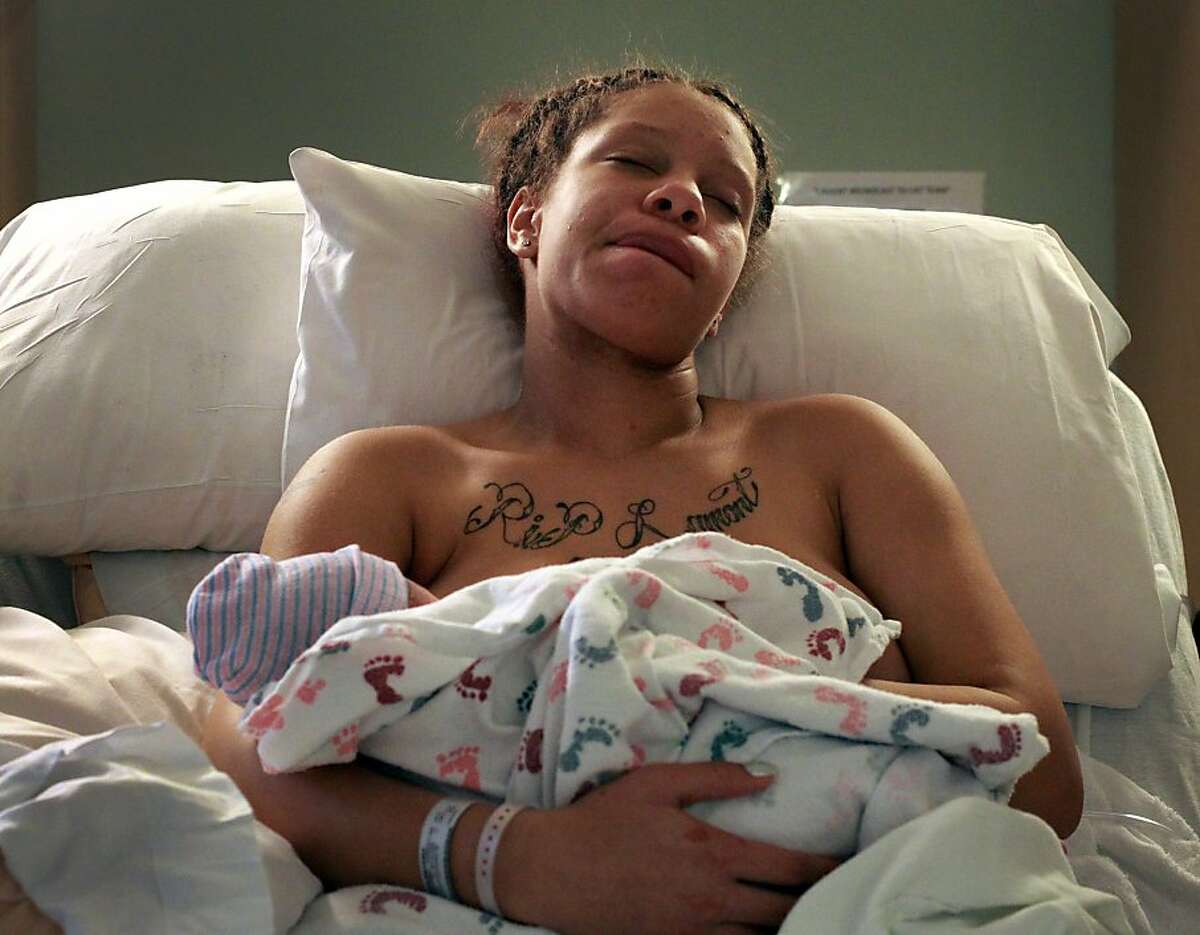 Brijjanna Price tries to rest after giving birth to her daughter La'Mya Deshana Price, Thursday Nov. 8, 2012, at Alta Bates Summit Medical Center in Berkeley, Calif. Photo: Lacy Atkins, The Chronicle