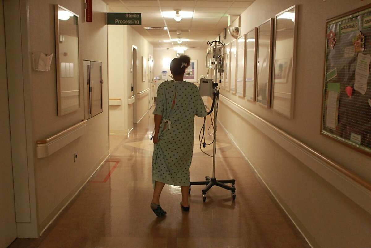 Brijjanna Price, 16, walks down the halls of the medical center to help accelerate her labor,  Wednesday  Nov. 7, 2012, at Alta Bates Summit Medical Center in Berkeley, Calif. She later delivered an 8 pound 4 ounces baby girl. Photo: Lacy Atkins, The Chronicle