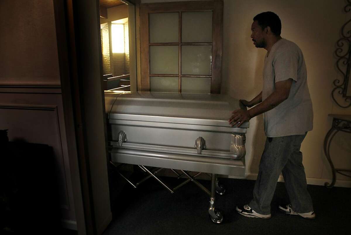 Reverend Ramon Price Sr. moving his son's casket into the chapel at the Whitted-Atkins Funeral Home,  for the family and friends viewing, Tuesday February 28, 2012,  in Oakland, Calif.  Lamont DeShaw Price, 17 years old, was killed February 16 on 81st and Birch in East Oakland. Photo: Lacy Atkins, The Chronicle