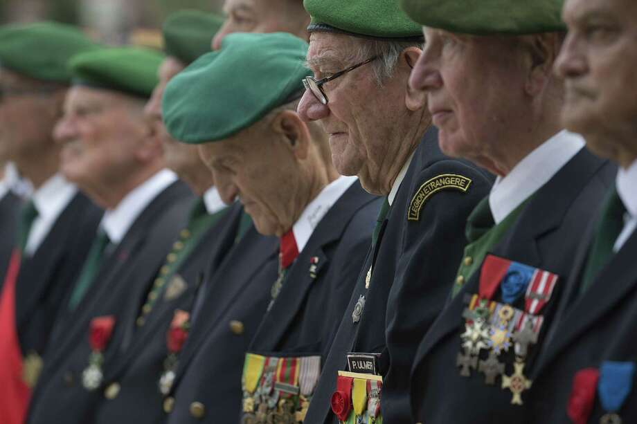 Veterans from the French Legion Etrangere (Foreign Legion) stand during a military ceremony in the Luxembourg Gardens in Paris, on July 13, 2015, the day before France marks Bastille Day celebrations. (Joel Saget/ AFP/ Getty Images Photo: JOEL SAGET, Staff / saget
