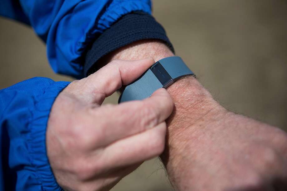 Fitbit has been selected for NIH’s first pilot project with wearables and will initially provide 10,000 wristbands. Dieting adults who wore activity monitors for 18 months lost significantly fewer pounds over that time than those who did not. Photo: CHARLIE MAHONEY, NYT