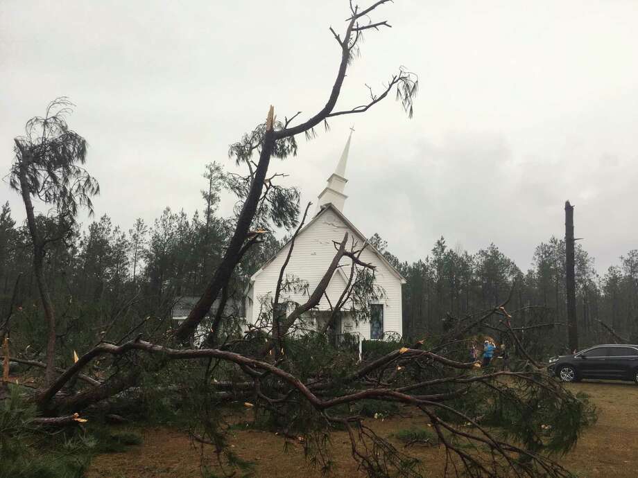 Fallen trees sit near Zoar United Methodist Church that sustained damage to its steeple Sunday, Jan. 22, 2017, near Baxley, Georgia. The National Weather Service said Sunday that southern Georgia, northern Florida and the corner of southeastern Alabama could face "intense and long track" tornadoes, scattered damaging winds and large hail. (AP Photo/Lewis Levine) Photo: Lewis Levine, FRE / AP
