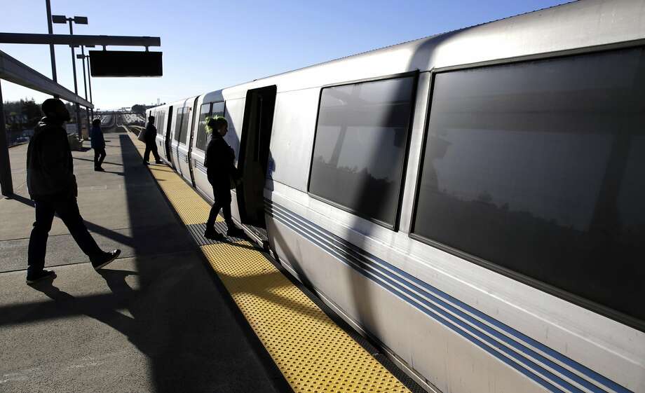In this file photo, passengers board a train at the Castro Valley BART station. Photo: Michael Macor, The Chronicle