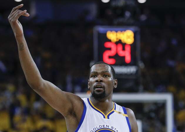 Finals MVP Durant celebrates with fans outside Oracle Arena