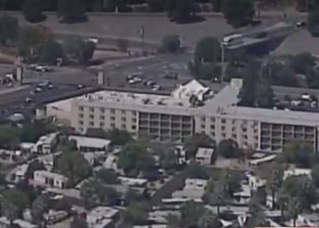 Officer shot dead, two others hit by gunfire at Sacramento hotel; suspect in custody