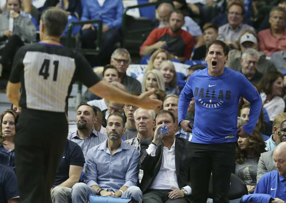 Dallas Mavericks owner Mark Cuban, right, yells at referee Ken Mauer (41) during the first half of an NBA basketball game against the Atlanta Hawks in Dallas, Wednesday, Oct. 18, 2017. (AP Photo/LM Otero) Photo: LM Otero, Associated Press