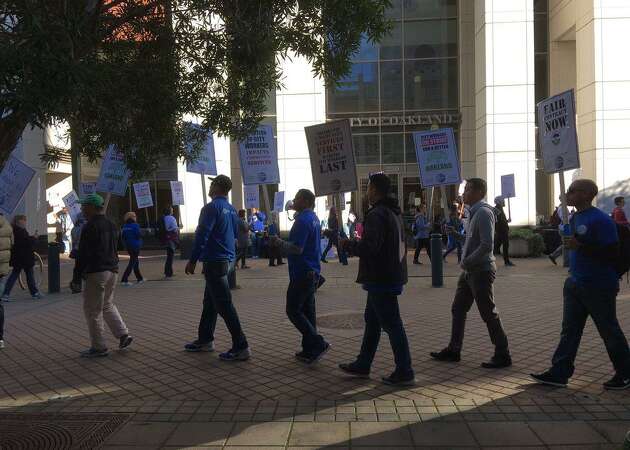 Thousands of striking Oakland city workers hit the picket lines